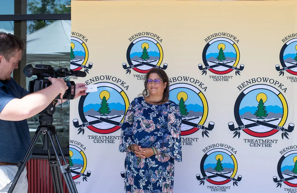 Backdrop of Grand Opening and TV crew filming Chantelle Evans